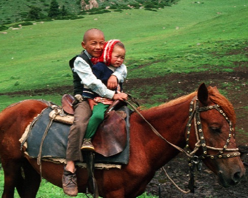 Kyrgyzstan-Two Children on Horseback.jpg